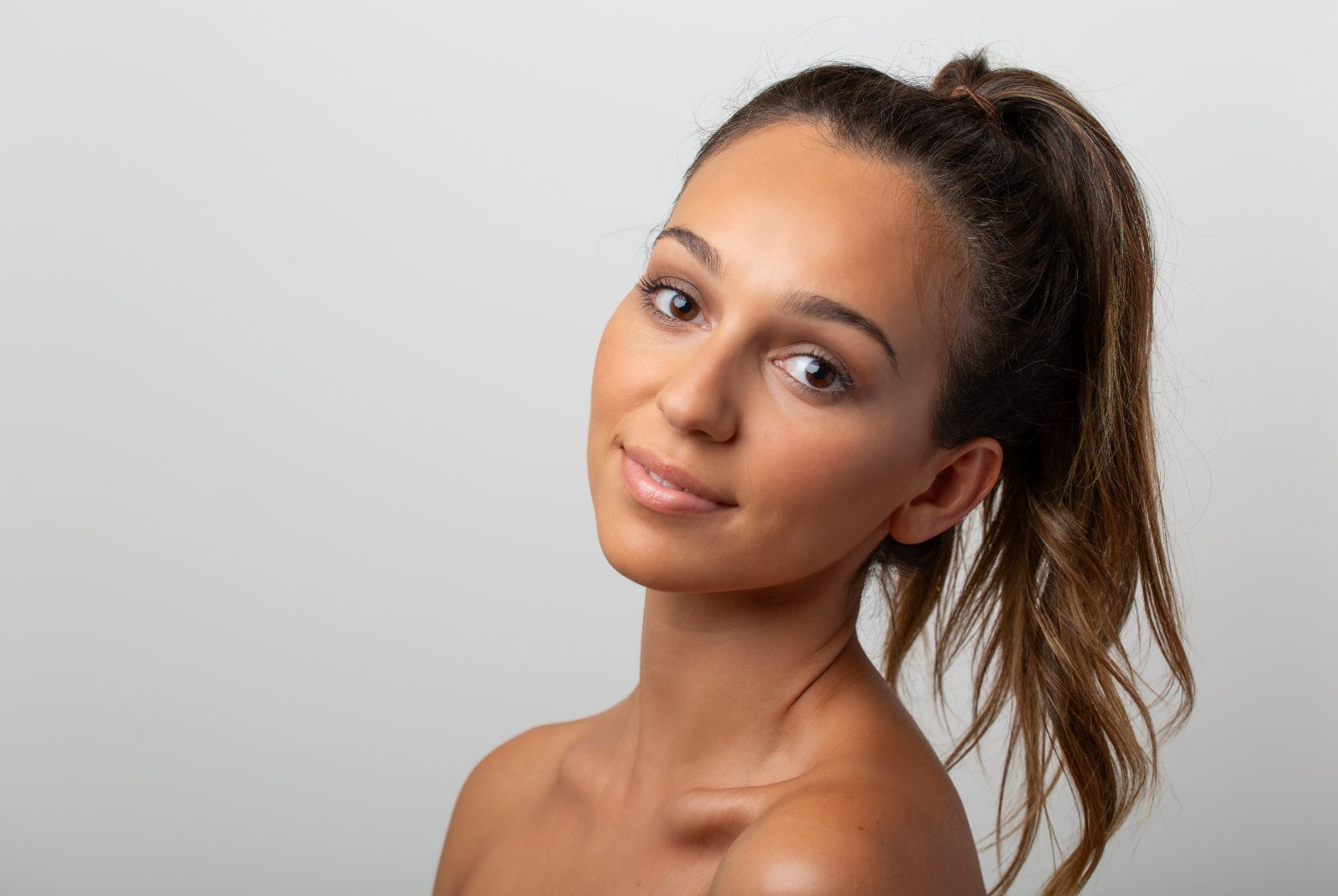 Three quarter beauty portrait with a ponytail