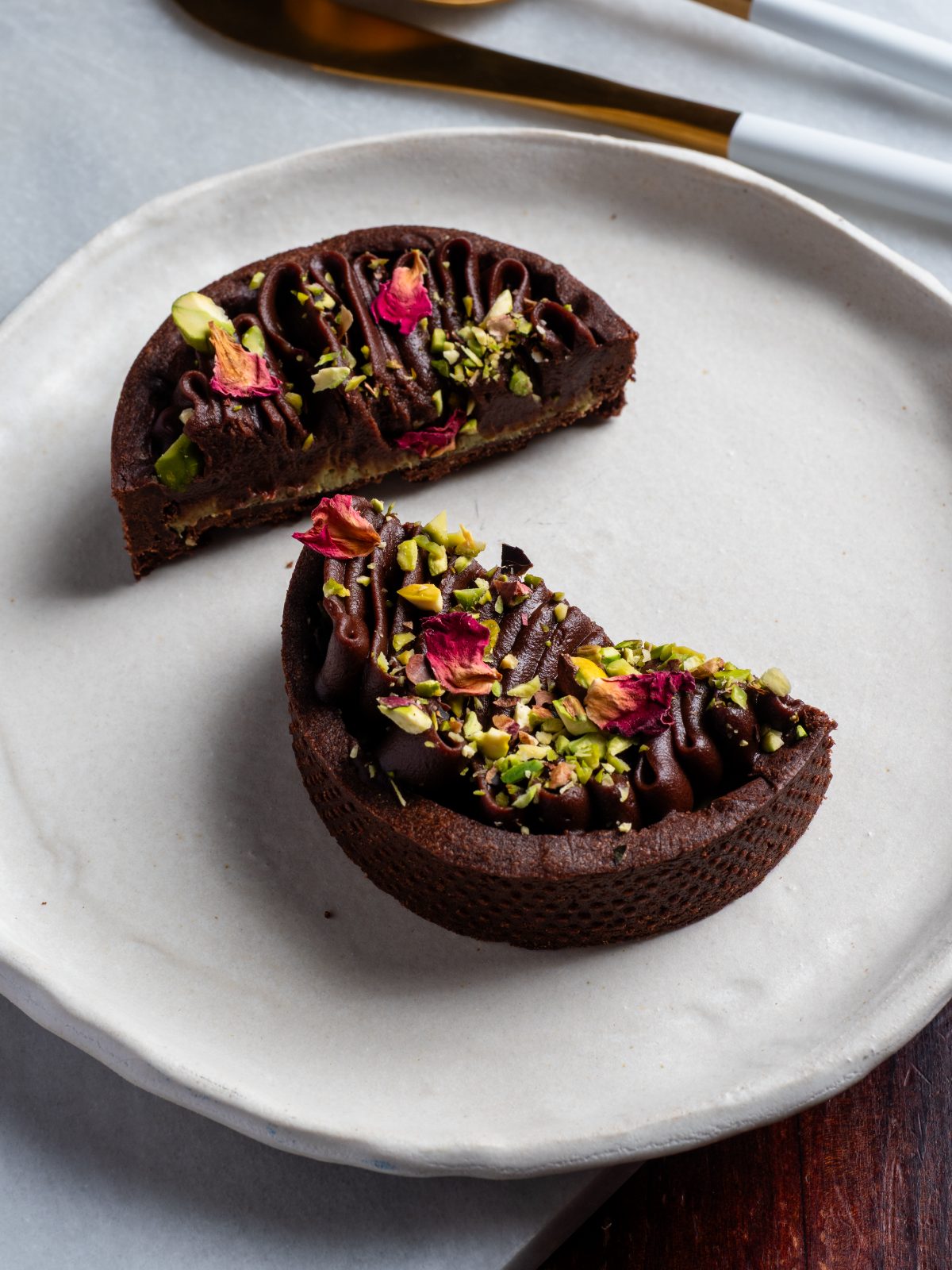 Chocolate and pistachio tart cut open