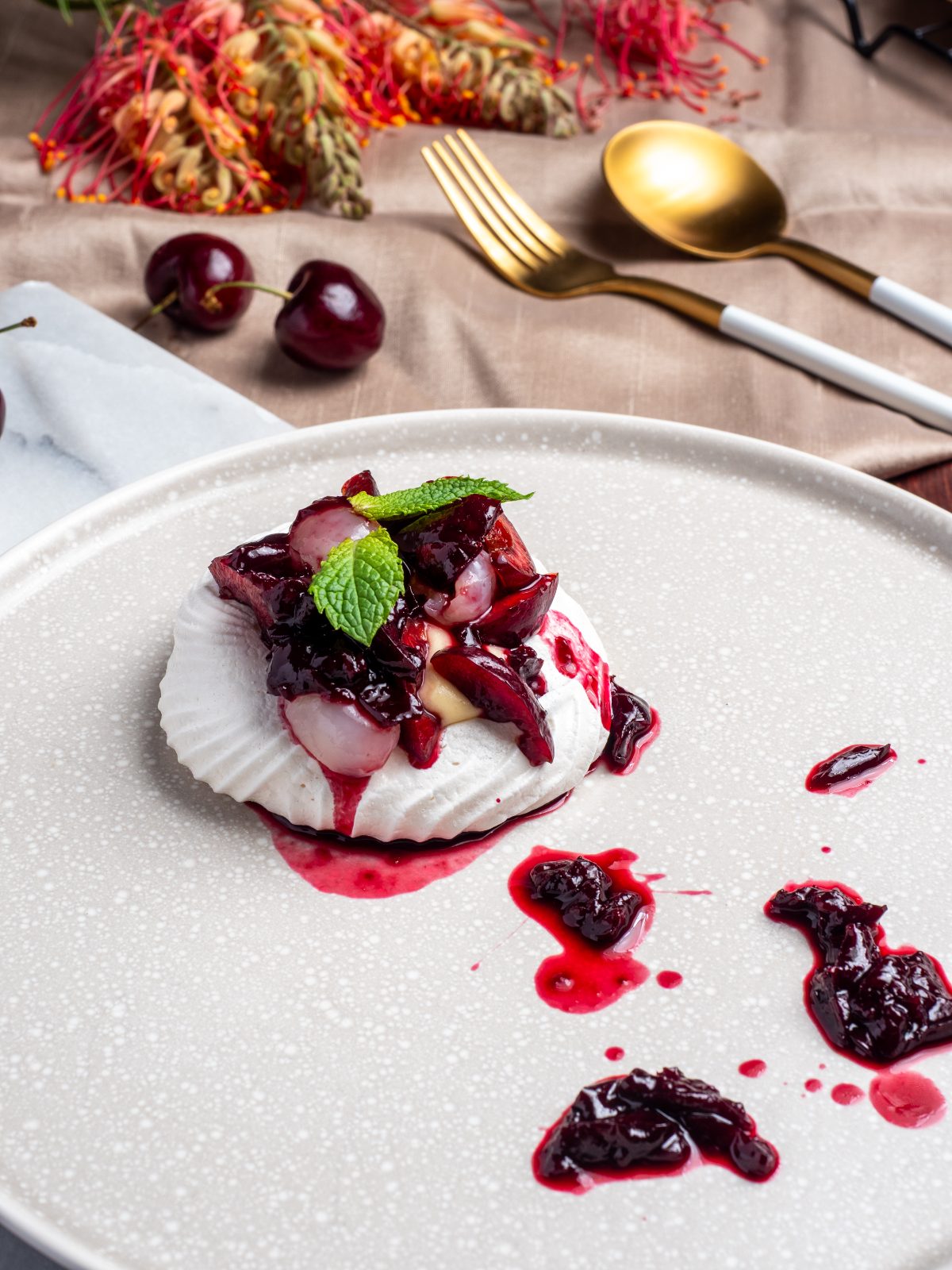 Cherry and lychee pavlova with native flowers