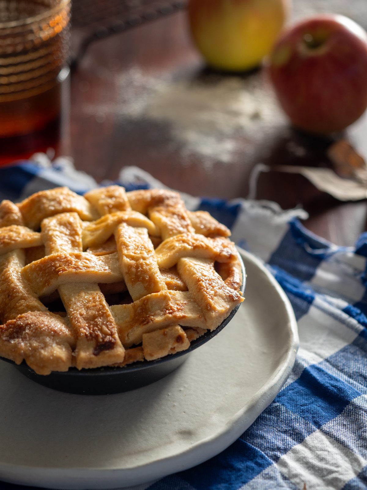 Apple pie with a lattice top on linen